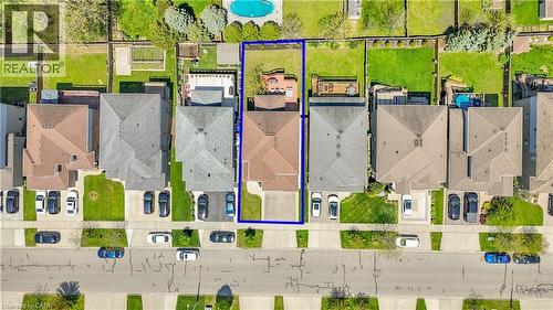 Aerial perspective showcasing the property's rectangular lot, featuring a paved driveway and a green lawn - 73 Fitzgerald Drive, Cambridge, ON - Other