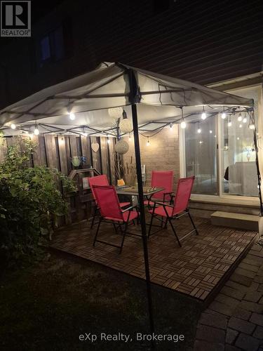 Patio at night - all items for sale - 44 - 40 Silvercreek Parkway N, Guelph (Junction/Onward Willow), ON - Outdoor