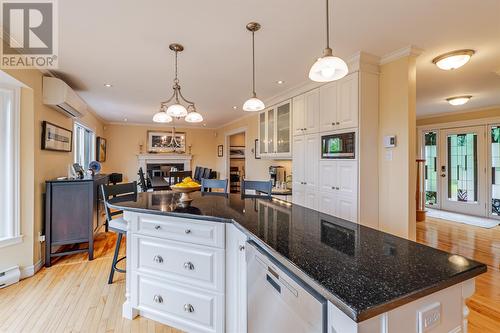 Spacious island features storage and seating for 3-4 - 131-139 Marine Drive, Logy Bay, Middle Cove, Outer Cove, NL - Indoor Photo Showing Kitchen