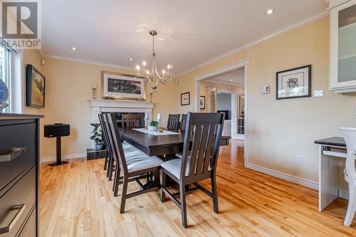 Spacious dining area with a propane fireplace for cozy family and friend dinners. - 131-139 Marine Drive, Logy Bay, Middle Cove, Outer Cove, NL - Indoor Photo Showing Dining Room With Fireplace