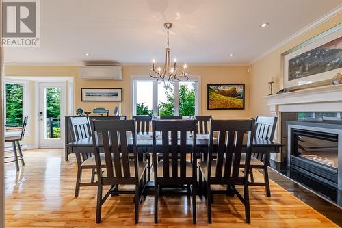Dining room with propane fireplace - 131-139 Marine Drive, Logy Bay, Middle Cove, Outer Cove, NL - Indoor Photo Showing Dining Room With Fireplace