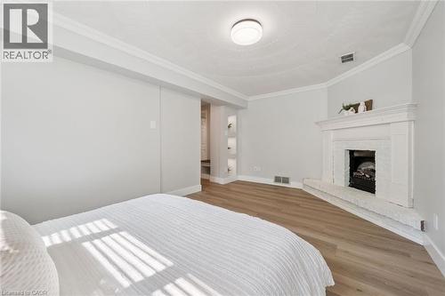 16 Nipigon Street, Kitchener, ON - Indoor Photo Showing Bedroom With Fireplace