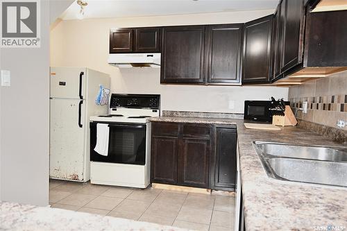 16 29Th Street E, Prince Albert, SK - Indoor Photo Showing Kitchen With Double Sink