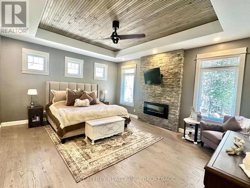 219 Kidds Road, Stone Mills (Stone Mills), ON - Indoor Photo Showing Bedroom With Fireplace