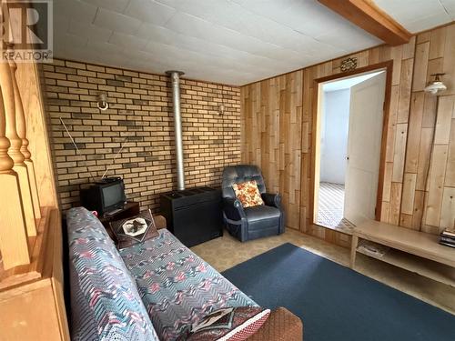 1202 Western Bay Line, Western Bay, NL - Indoor Photo Showing Other Room With Fireplace