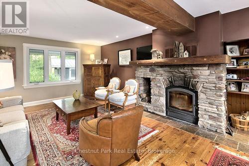 Wood storage is 5' from acces door to inside wood - 114 Clark Street, Blue Mountains, ON - Indoor Photo Showing Living Room With Fireplace