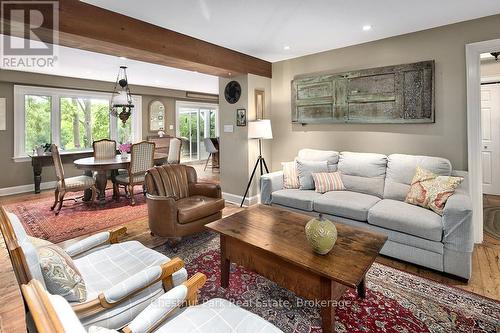 Round disk is a hot air return for the fireplace - 114 Clark Street, Blue Mountains, ON - Indoor Photo Showing Living Room