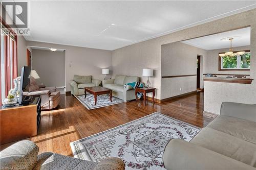 Hardwood-finish flooring throughout the main living area - 134 Russ Road, Grimsby, ON - Indoor Photo Showing Other Room