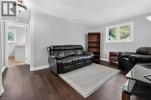 Living area with dark wood-finish flooring and light gray walls - 134 Russ Road, Grimsby, ON - Indoor Photo Showing Other Room