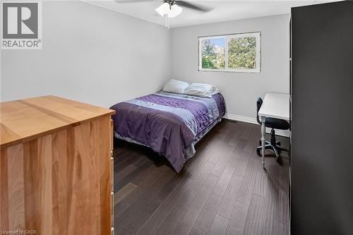 Room featuring dark wood-finish flooring, light grey walls, and a ceiling fan with integrated lighting - 134 Russ Road, Grimsby, ON - Indoor Photo Showing Bedroom