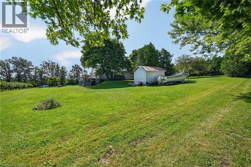 Expansive green lawn with mature trees and a detached shed - 134 Russ Road, Grimsby, ON - Outdoor