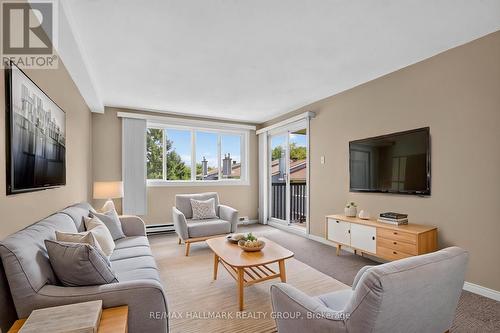 Living Room - virtually staged - 306 - 6470 Bilberry Drive, Ottawa, ON - Indoor Photo Showing Living Room