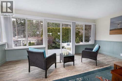 Sunroom facing front yard. Patio doors to front patio. - 2527 Islandview Road, Blind Bay, BC - Indoor