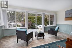Sunroom facing front yard. Patio doors to front patio. - 