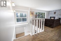 Main floor entrance, stairs to basement. Large beautiful window above stairs with ample storage under window. - 