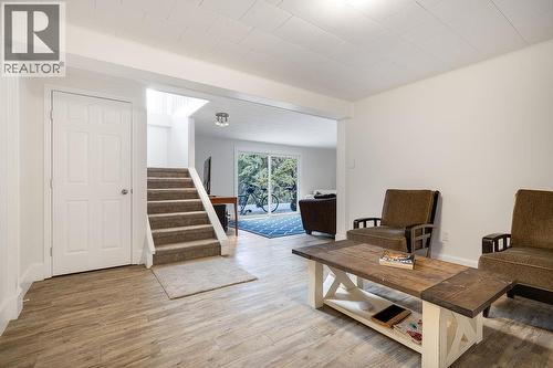 Flex space at the bottom of stairs in basement. Storage under staircase entrance to rec. room and other bedrooms/ powder room and laundry. Yard and garage/carport access. - 2527 Islandview Road, Blind Bay, BC - Indoor