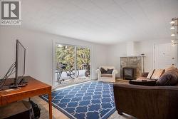 Rec. room with fireplace and patio doors to back yard & hot tub. - 
