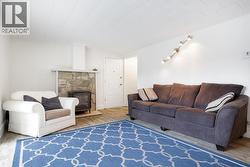 Rec. room, entrance to garage/carport and 5th bedroom. - 