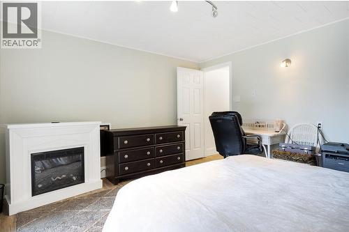 Third bedroom with added fireplace. - 2527 Islandview Road, Blind Bay, BC - Indoor Photo Showing Bedroom With Fireplace