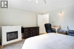 Third bedroom with added fireplace. - 