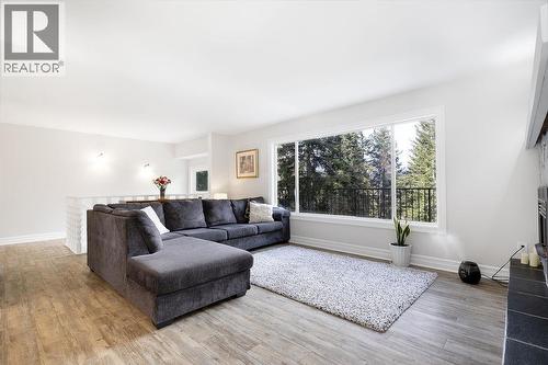 Living room. Stairs to the basement are behind the couch area. Very open and airy space. - 2527 Islandview Road, Blind Bay, BC - Indoor Photo Showing Living Room