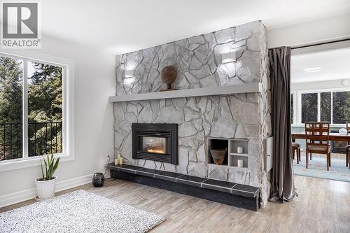 Fire place in the living room - 2527 Islandview Road, Blind Bay, BC - Indoor Photo Showing Living Room With Fireplace
