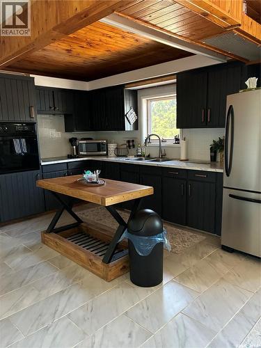 302 Barrier Bay, Barrier Lake, SK - Indoor Photo Showing Kitchen With Double Sink