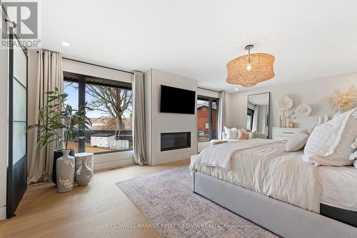 1060 River Road, Ottawa, ON - Indoor Photo Showing Bedroom With Fireplace