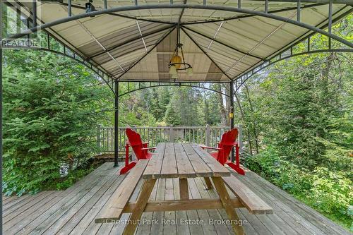 Covered Deck Overlooking Rapids - 8488 County Road 503 Road, Highlands East (Glamorgan), ON - Outdoor With Deck Patio Veranda