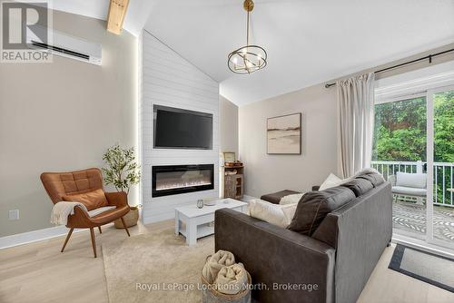 305 - 5 Dawson Drive, Collingwood, ON - Indoor Photo Showing Living Room With Fireplace