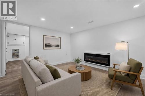Virtually Staged - 36 Mahony Avenue, Hamilton, ON - Indoor Photo Showing Living Room With Fireplace