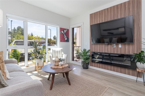 #106-120 Jensen Ave West, Parksville, BC - Indoor Photo Showing Living Room With Fireplace