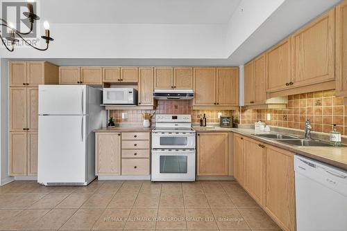 509 - 2500 Rutherford Road, Vaughan, ON - Indoor Photo Showing Kitchen With Double Sink