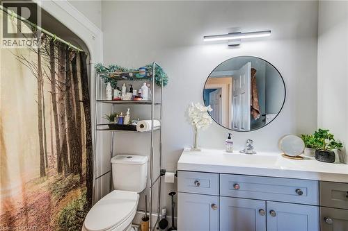 Bathroom vanity with a white countertop, undermount sink, and light gray cabinetry - 233 Red Clover Court, Kitchener, ON - Indoor Photo Showing Bathroom