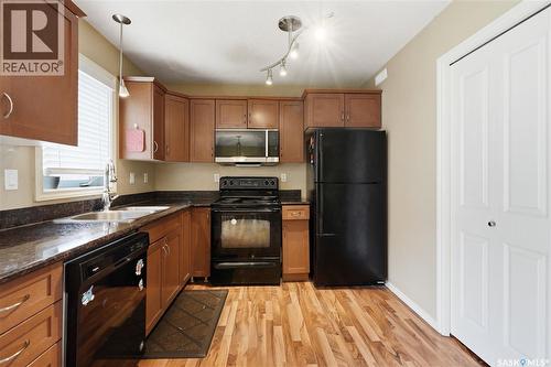 312 303 Slimmon Place, Saskatoon, SK - Indoor Photo Showing Kitchen With Double Sink