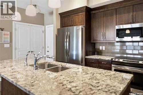 205 3702 Haughton Road, Regina, SK - Indoor Photo Showing Kitchen With Stainless Steel Kitchen With Double Sink With Upgraded Kitchen