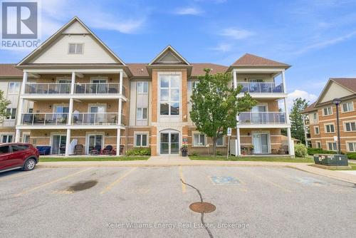 204 - 124 Aspen Springs Drive, Clarington (Bowmanville), ON - Outdoor With Balcony With Facade