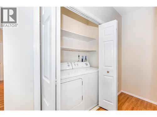Hallway closet is hosting the laundry appliances - 3805 30 Avenue Unit# 112, Vernon, BC - Indoor Photo Showing Laundry Room