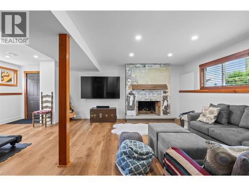 5054 Chute Lake Crescent, Kelowna, BC - Indoor Photo Showing Living Room With Fireplace
