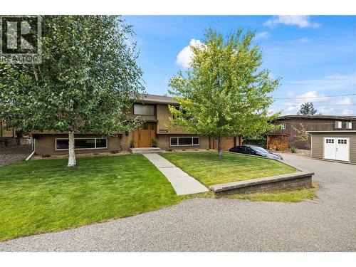 Large driveway on the right side of the home, RV parking on the left side of the home - 5054 Chute Lake Crescent, Kelowna, BC - Outdoor