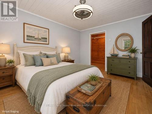 Main lvl Primary bedroom w walk-in closet, staged - 15 Victoria Street W, Seguin, ON - Indoor Photo Showing Bedroom