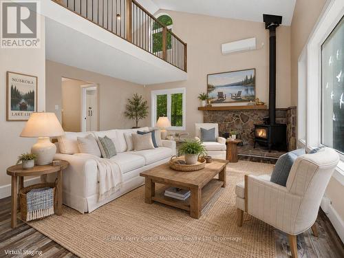 Living room w stone fireplace, staged - 15 Victoria Street W, Seguin, ON - Indoor Photo Showing Living Room With Fireplace