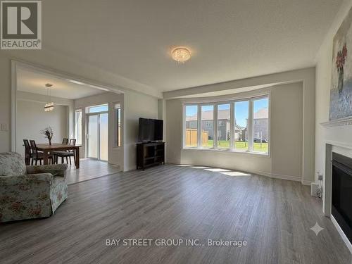 27 Samuel Crescent, Springwater, ON - Indoor Photo Showing Living Room With Fireplace