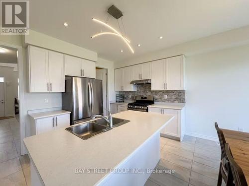 27 Samuel Crescent, Springwater, ON - Indoor Photo Showing Kitchen With Double Sink With Upgraded Kitchen
