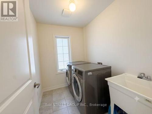 27 Samuel Crescent, Springwater, ON - Indoor Photo Showing Laundry Room