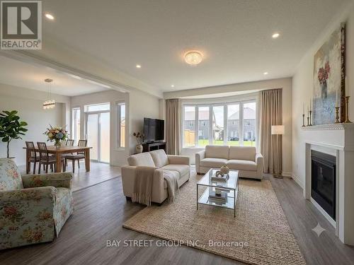 Virtual Staged Photos - 27 Samuel Crescent, Springwater, ON - Indoor Photo Showing Living Room With Fireplace