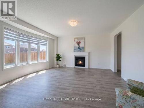 27 Samuel Crescent, Springwater, ON - Indoor Photo Showing Living Room With Fireplace