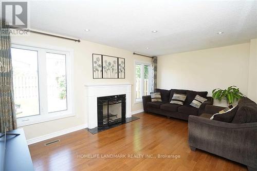 4887 Natkarni Crescent, Mississauga, ON - Indoor Photo Showing Living Room With Fireplace