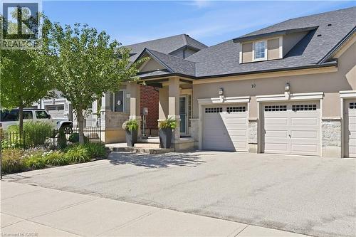 Stucco exterior with stone accents and a grey shingle roof - 10 Kopperfield Lane, Hamilton, ON - Outdoor With Facade