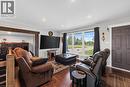 Spacious room featuring wood-finish flooring, recessed lighting, and a prominent window offering exterior views - 184726 Cornell Road, Tillsonburg, ON  - Indoor Photo Showing Living Room 